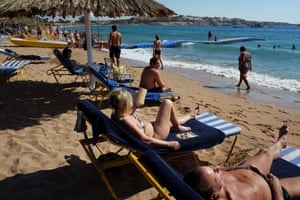 Tourists enjoy the beach in the Egyptian Red Sea resort of Sharm el-Sheikh.