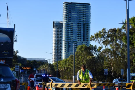 Authorities cordon off a street leading to the Opal Tower at Sydney Olympic Park in Sydney on Christmas Eve.