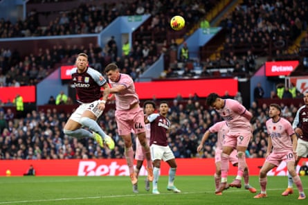 Ross Barkley jumps above Veljko Milosavljevic to head the ball