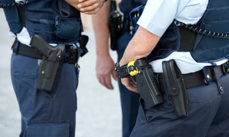 Police officers with a Taser