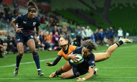Katana Howard of the USA scores a try against Australia.
