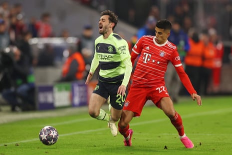 Bernardo Silva of Manchester City is fouled by Bayern Munich’s Joao Cancelo.