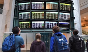 Flight cancellations and delays seen on screens in Orlando airport, Florida