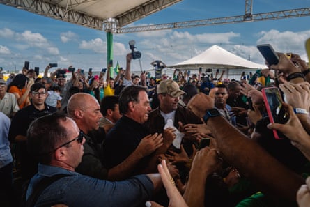 Jair Bolsonaro is welcomed by supporters during the inauguration of a new train station in Parnamirim, Rio Grande do Norte.