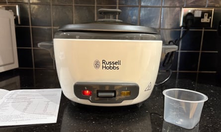 The Russell Hobbs large rice cooker in white on a black kitchen worktop