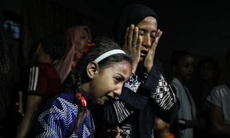Mourners at the funeral of an eight-month-old child in Gaza City