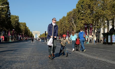 People on the Champs-Élysées during a car-free day in Paris
