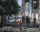 ‘No place is safe’: families flee Gaza City as Israel vows to press on with offensive