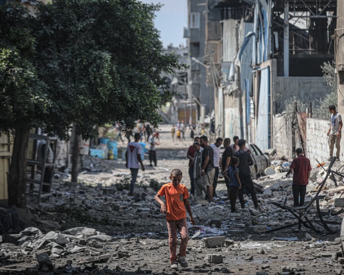 ‘No place is safe’: families flee Gaza City as Israel vows to press on with offensive