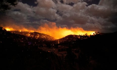 The McBride fire burns in the heart of the village in Ruidoso, New Mexico, on 12 April.