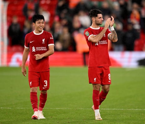 Wataru Endo (left) and Dominik Szoboszlai (right) applaud the fans at the end of the Carabao Cup Third Round match between Liverpool and Leicester City at Anfield.