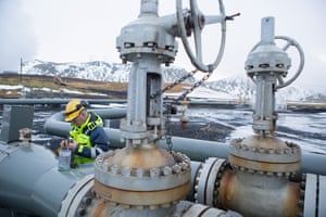 A man works on a pipe beside a carbon injection site well near Reykjavik Energy's Hellisheidi Geothermal Power Plant, on December 4, 2017 outside Reykjavik, Iceland. To offset global warming, since year 2007, scientists have collaborated with Reykjavik Energy's experts, technicians, and tradespeople on developing the idea and implementation of fixating CO2 into basaltic rock.
