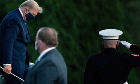 US President Donald Trump walks off Marine One while arriving at Walter Reed Medical Center in Bethesda, Maryland after testing positive for covid-19. President Donald Trump will spend the coming days in a military hospital just outside Washington to undergo treatment for the coronavirus, but will continue to work, the White House said.