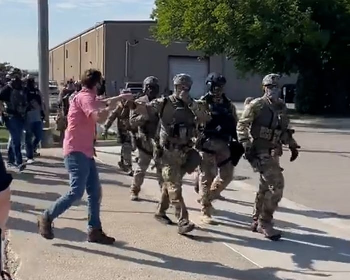 Protesters confront Ice agents outside immigration facility near Chicago – video
