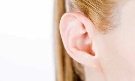 Close-up of a woman’s ear, right side