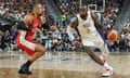 LeBron James of the United States drives against Dillon Brooks of Canada in the second half of their exhibition game ahead of the Paris Olympic Games at T-Mobile Arena on Wednesday.