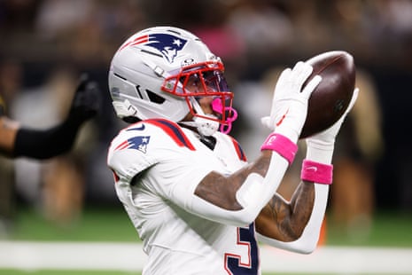 Wide receiver Demario Douglas catches the pass for the opening touchdown for New England.