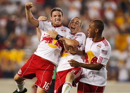 John Rooney (left) celebrates with fellow goalscorer Corey Hertzog (centre) and Juan Agudelo after scoring the winning goal in New York Red Bull’s June 2011 US Open Cup third round match against FC New York.