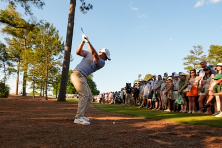 Rory McIlroy hits from the pine straw on the 18th hole on Sunday at the Masters