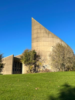 A modernist, brutalist church building with an angled roof