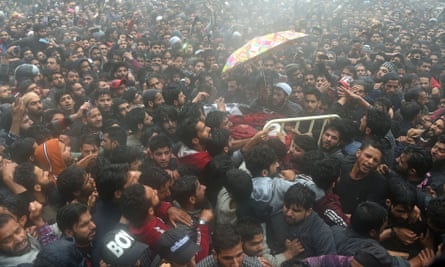 Kashmiri villagers carry Zakir Musa’s body during his funeral procession at Dadsar village in Tral, south of Srinagar, on 24 May.