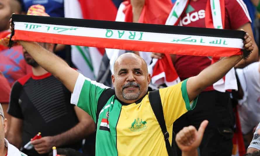 An Iraq fan in his dual-identity shirt.