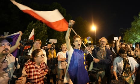 People protest outside the Polish parliament in Warsaw after lawmakers passed a bill seen as harmful to media freedom.