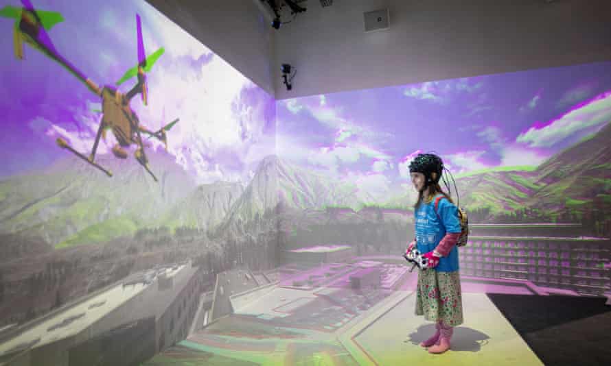 Serena inside the Cave, an immersive VR environment created to test children’s brains.