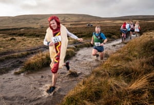 Haworth, UK. A sausage competes in the Auld Lang Syne fell race which attracts hundreds of runners every year.