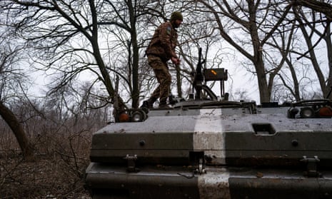 A soldier prepares his vehicle near the Bakhmut frontlines with Russia on 22 January 2023 in Chasov Yar, Ukraine.