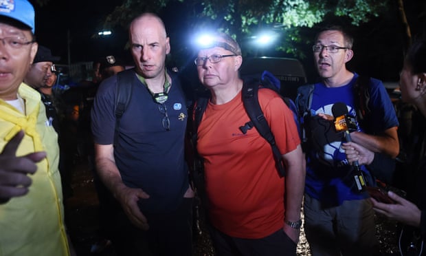 British cave divers Richard Stanton (2nd-L), Robert Charles Harper (3rd-L) and John Volanthen (R) arrive near the Tham Luang cave to join the search for the trapped boys