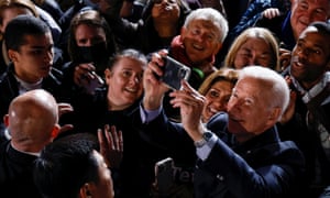 On the campaign trail: Joe Biden takes a picture in the crowd while campaigning for Democratic candidate for governor of Virginia Terry McAuliffe at a rally in Arlington, Virginia, U.S. October 26, 2021. McAuliffe lost to the Republican.