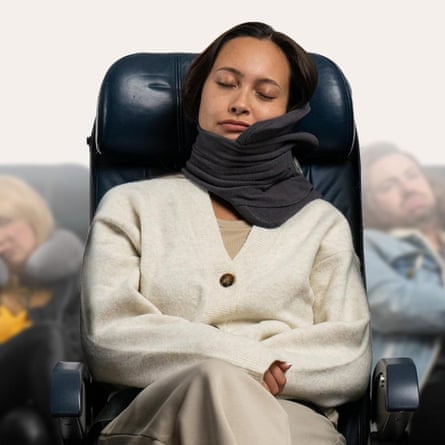 A woman using a Trtl Neck Pillow