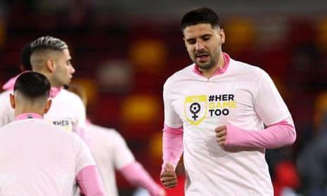 Aleksandar Mitrovic warms up in a #HerGameToo T-shirt alongside his Fulham teammates.
