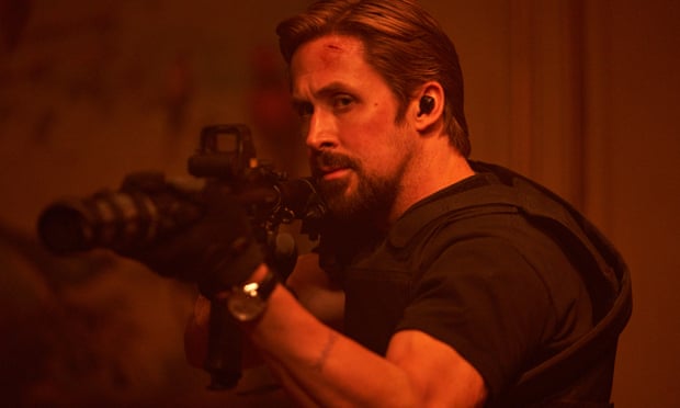 Sierra Six (Ryan Gosling) with a gun in The Gray Man.