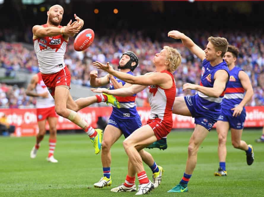 Jarrad McVeigh of the Swans attempts to mark .