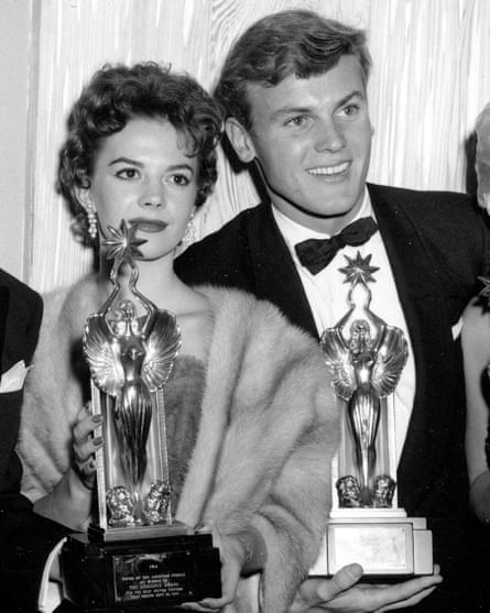 Natalie Wood and Tab Hunter pose with trophies at the Audience Awards in Los Angeles on 6 December 1955.