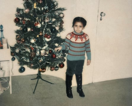 Andrea Bernard standing next to a Christmas tree