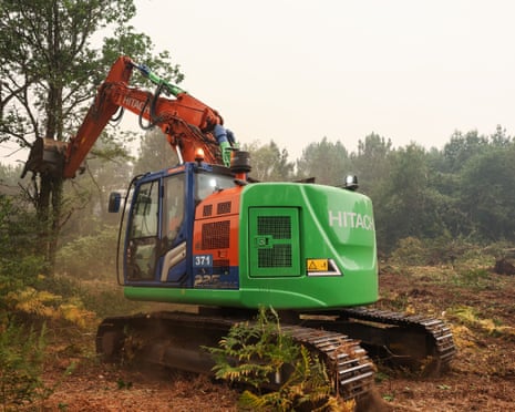 An excavator tears out trees to construct a firebreak in a forest near Cestas, some 17km from Bordeaux, France.