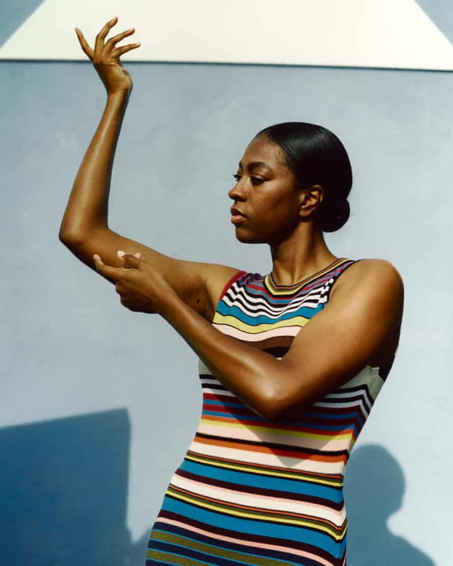 Model wearing Paul Smith colourful bright striped dress spring summer 2022 fashion trend