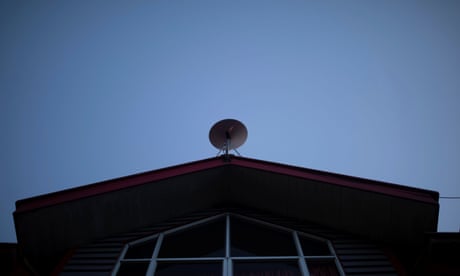 The Wider Image: Elon Musk's satellites beam internet into Chilean boy's life<br>The Starlink antenna is seen on the roof of the John F Kennedy School located in the village of Sotomo, outside the town of Cochamo, Los Lagos region, Chile, August 7, 2021. Picture taken August 7, 2021. Sotomo is one of two places in Chile to be chosen for a pilot project run by billionaire Elon Musk to receive free internet for a year. The signal is received via a satellite dish installed on the school's roof, which transmits through a Wi-Fi device. REUTERS/Pablo Sanhueza SEARCH "SOTOMO SANHUEZA" FOR THIS STORY. SEARCH "WIDER IMAGE" FOR ALL STORIES.