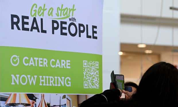 Job seekers scan a QR code with their phone for an online job application