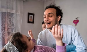 Egyptian photojournalist Mahmoud Abu Zeid, widely known as Shawkan, plays with his niece at his home in the capital Cairo on March 4, 2019.