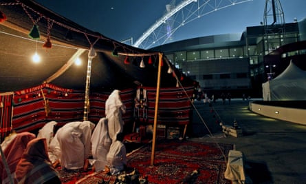 Qataris pray in a Bedouin tent before the opening ceremony of the Asian Cup outside Khalifa Stadium in Doha in January 2011.