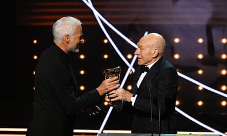 Patrick Stewart presents the award for the outstanding British film winner to Martin McDonagh for The Banshees of Inisherin.