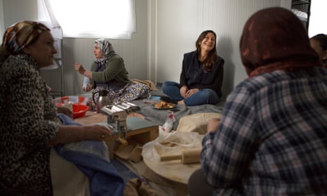 Dina Nayeri sits with other Iranian women to prepare food in a refugee camp in Greece in 2016.