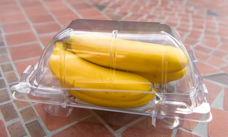 Bananas in a plastic container.