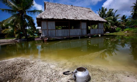 An abandoned house that has been affected by sea-water during high tides near the village of Tangintebu in the central Pacific Island nation of Kiribati.