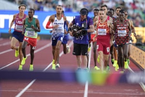 A cameraman gets in the way during the men’s 3000m steeplechase.