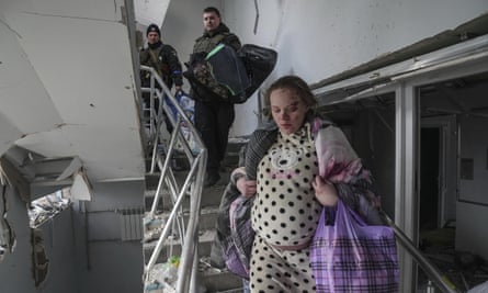 Mariana Vishegirskaya walks down the stairs of the bombed maternity hospital in Mariupol, Ukraine.